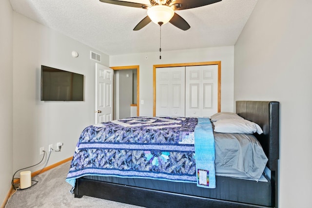 13848 52nd Ave N, Plymouth, MN 55446 - bedroom featuring carpet flooring, a closet, a ceiling fan, and a textured ceiling