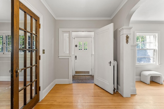 2901 Vincent Ave N, Minneapolis, MN 55411 - entryway with arched walkways, light wood-type flooring, crown molding, and baseboards