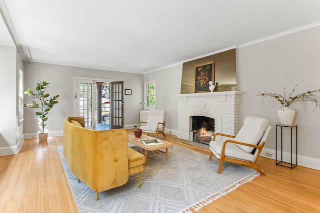 2901 Vincent Ave N, Minneapolis, MN 55411 - living room with wood finished floors, a brick fireplace, baseboards, and crown molding
