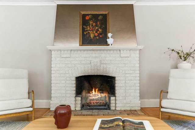 2901 Vincent Ave N, Minneapolis, MN 55411 - living area with crown molding, baseboards, a brick fireplace, and wood finished floors
