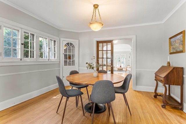 2901 Vincent Ave N, Minneapolis, MN 55411 - dining area with light wood finished floors, baseboards, healthy amount of natural light, and ornamental molding