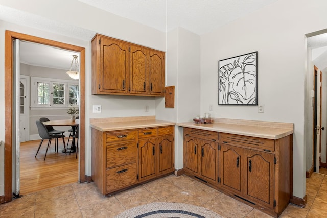 2901 Vincent Ave N, Minneapolis, MN 55411 - kitchen featuring brown cabinets and light countertops