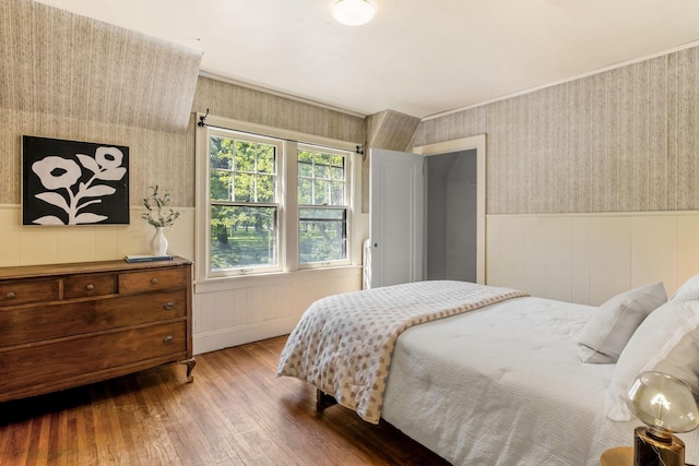 2901 Vincent Ave N, Minneapolis, MN 55411 - bedroom featuring wood finished floors, a wainscoted wall, and wallpapered walls