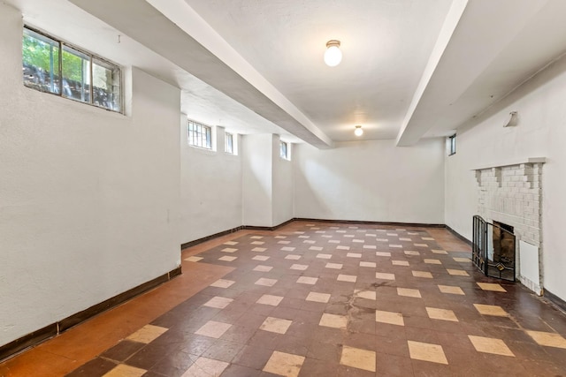 2901 Vincent Ave N, Minneapolis, MN 55411 - basement featuring a brick fireplace and baseboards