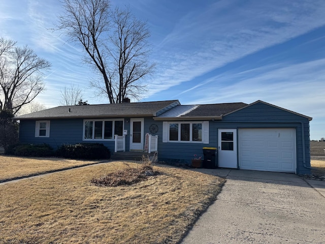 single story home with a garage and driveway
