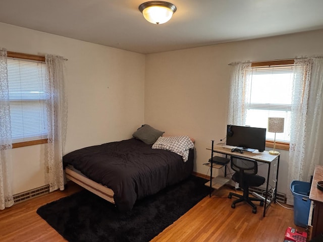 bedroom featuring light wood-style floors