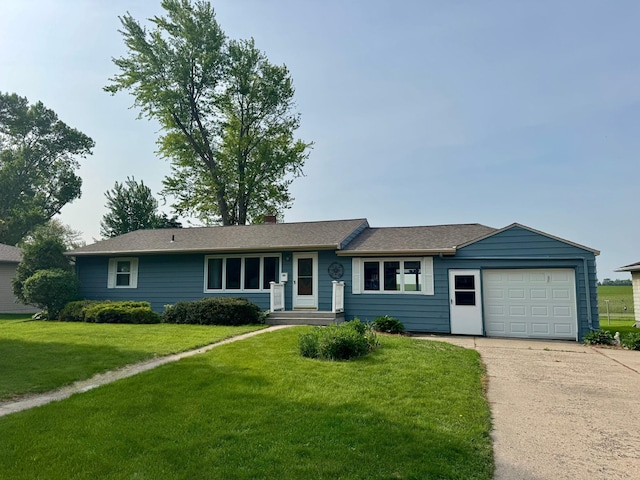 1001 Birch Ave, Olivia, MN 56277 - ranch-style home with concrete driveway, a front yard, and an attached garage