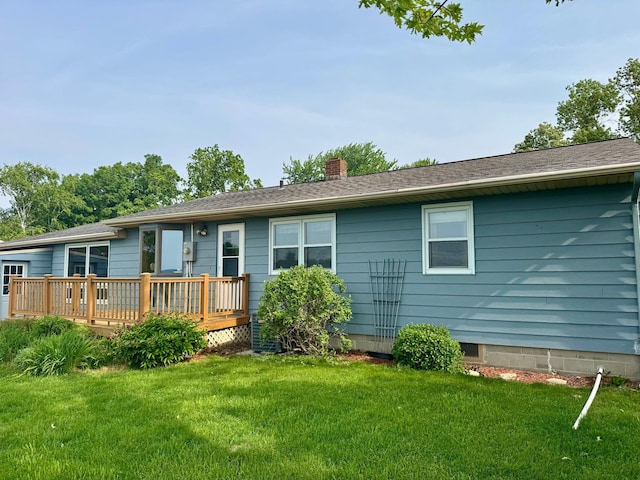 1001 Birch Ave, Olivia, MN 56277 - rear view of house with a wooden deck, a chimney, and a yard