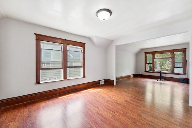 906 5th St E, Saint Paul, MN 55106 - bonus room with vaulted ceiling, wood finished floors, and baseboards