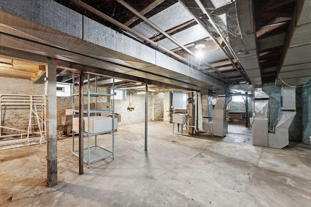 906 5th St E, Saint Paul, MN 55106 - basement with heating unit and a sink