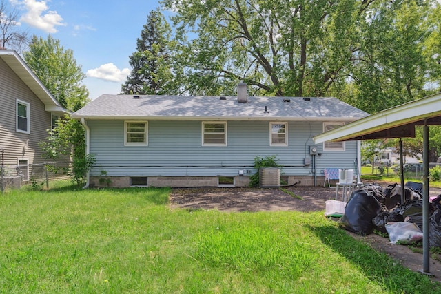 2237 Holloway Ave E, North Saint Paul, MN 55109 - rear view of property with a chimney