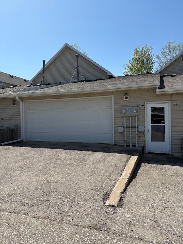 40 Broadway, Plainview, MN 55964 - garage featuring asphalt driveway