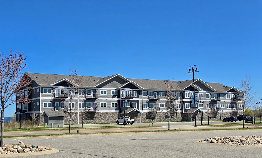 715 Lake Shore Dr NE Unit 208, Bemidji, MN 56601 - view of property with a residential view