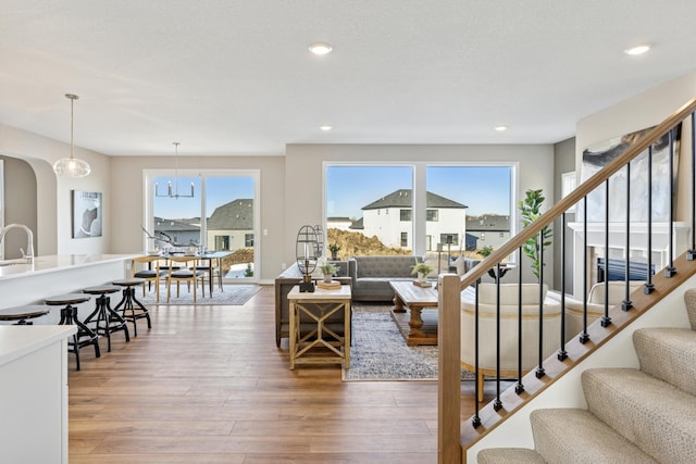5107 Allen Dr, Woodbury, MN 55129 - living room with plenty of natural light, light wood-type flooring, stairs, and recessed lighting