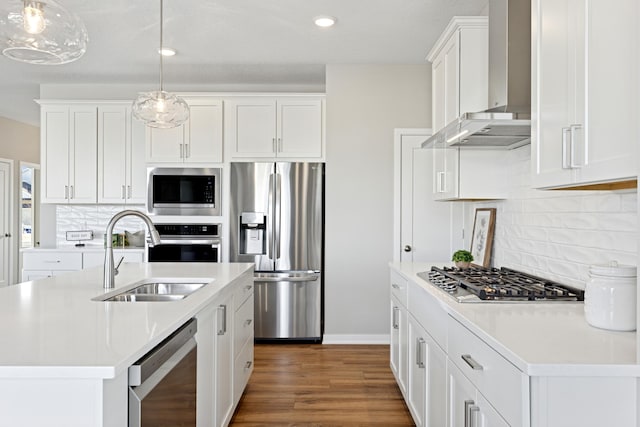 5107 Allen Dr, Woodbury, MN 55129 - kitchen with appliances with stainless steel finishes, wall chimney exhaust hood, a sink, light countertops, and tasteful backsplash