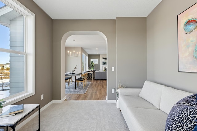 5107 Allen Dr, Woodbury, MN 55129 - carpeted living area with arched walkways and baseboards