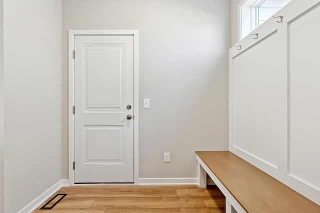5107 Allen Dr, Woodbury, MN 55129 - mudroom with baseboards and light wood-style floors