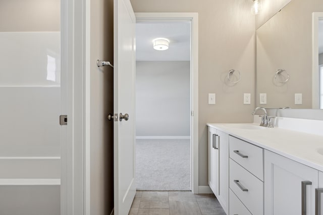 5107 Allen Dr, Woodbury, MN 55129 - full bath featuring double vanity, baseboards, and tile patterned floors
