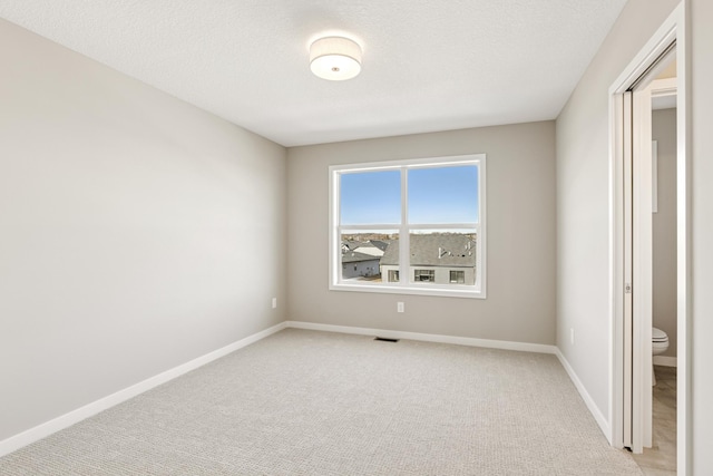 5107 Allen Dr, Woodbury, MN 55129 - unfurnished bedroom featuring light carpet and baseboards