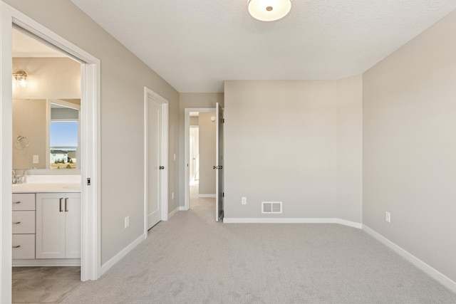 5107 Allen Dr, Woodbury, MN 55129 - unfurnished bedroom featuring light carpet, baseboards, and ensuite bathroom
