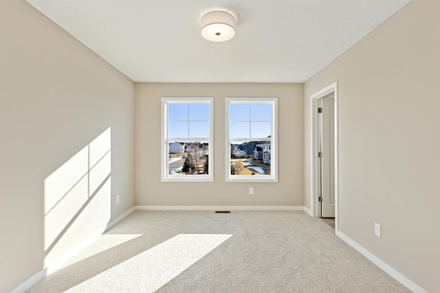 5107 Allen Dr, Woodbury, MN 55129 - spare room with light carpet and baseboards