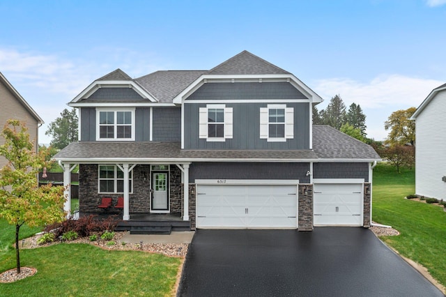 6317 153rd St, Savage, MN 55378 - craftsman inspired home featuring stone siding, a porch, asphalt driveway, and a front lawn