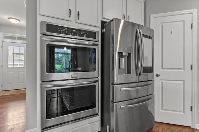6317 153rd St, Savage, MN 55378 - kitchen with appliances with stainless steel finishes, healthy amount of natural light, and dark wood-style flooring