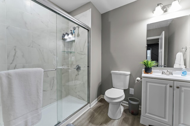 6317 153rd St, Savage, MN 55378 - bathroom with toilet, wood finished floors, a stall shower, and vanity
