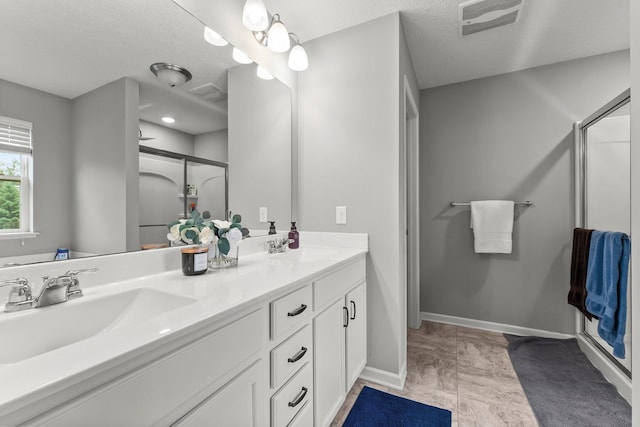 6317 153rd St, Savage, MN 55378 - full bathroom featuring a stall shower, double vanity, and baseboards