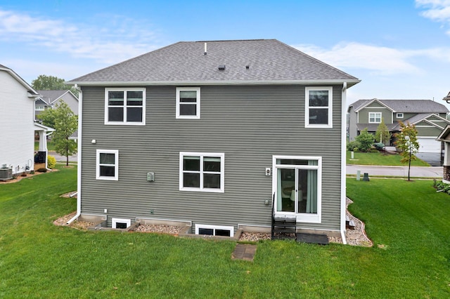 6317 153rd St, Savage, MN 55378 - back of property with a lawn, cooling unit, and roof with shingles
