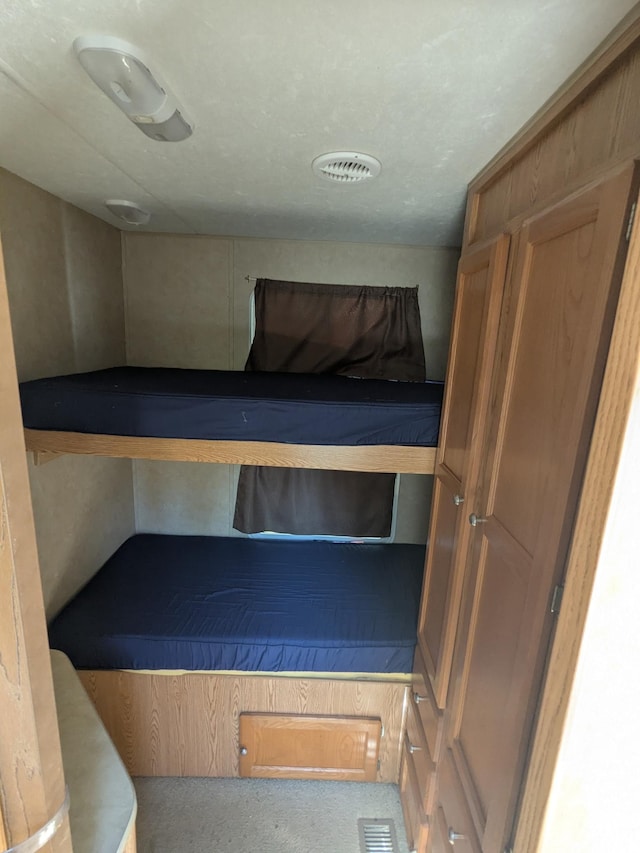 unfurnished bedroom with carpet flooring
