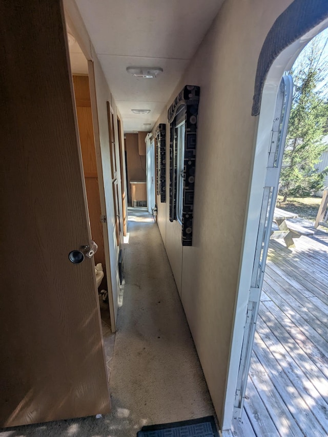 hall featuring arched walkways
