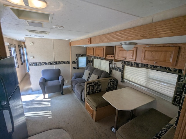 living area with light carpet