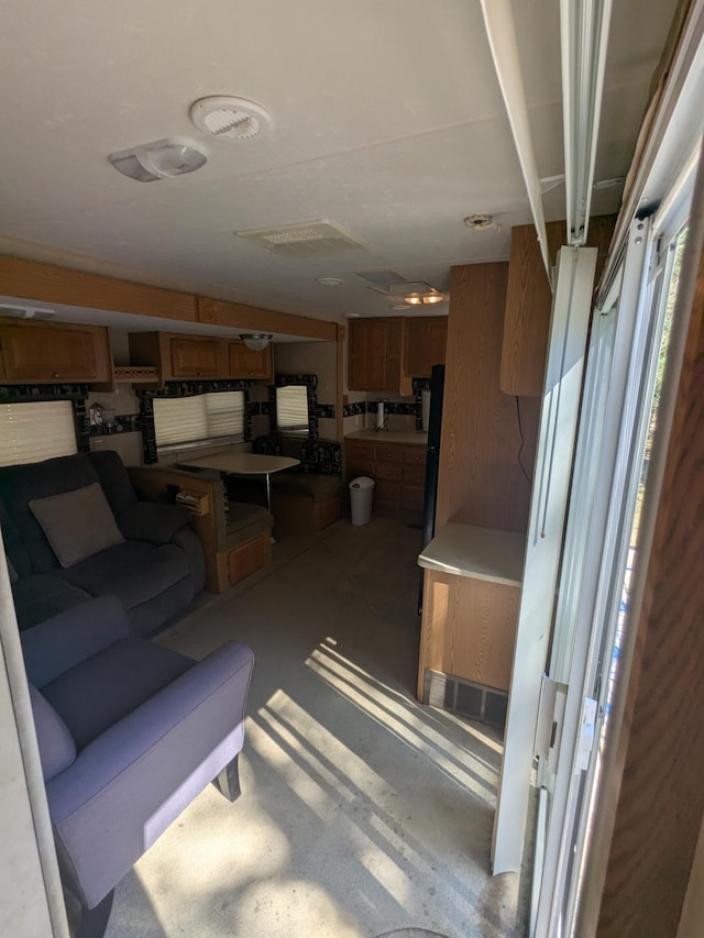 living area featuring concrete floors
