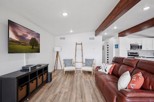 30558 376th Ave, Nordland Twp, MN 56431 - living room featuring light wood finished floors, recessed lighting, and beam ceiling
