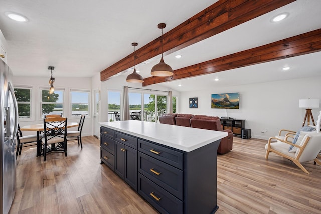 30558 376th Ave, Nordland Twp, MN 56431 - kitchen with recessed lighting, light wood finished floors, stainless steel fridge, decorative light fixtures, and open floor plan