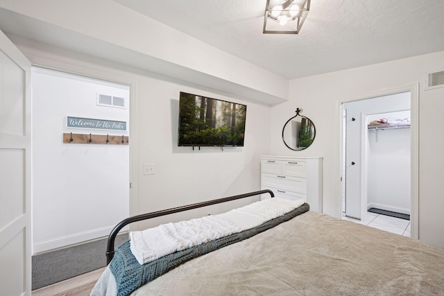 30558 376th Ave, Nordland Twp, MN 56431 - bedroom with a textured ceiling, a spacious closet, and a closet