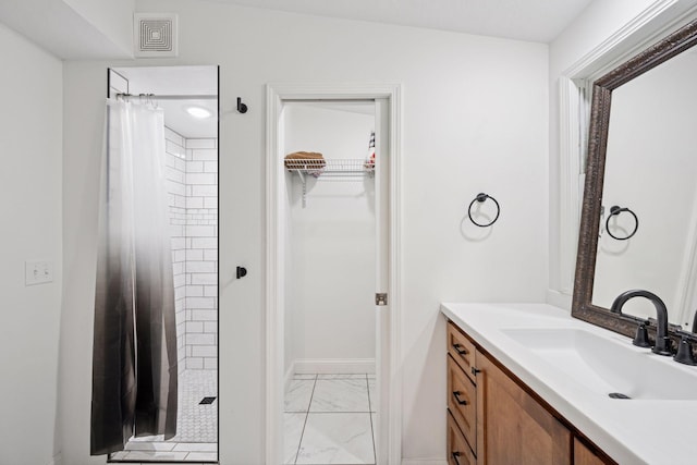 30558 376th Ave, Nordland Twp, MN 56431 - bathroom with marble look tile flooring, a stall shower, vanity, and a spacious closet