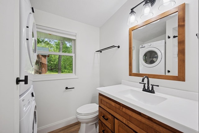 30558 376th Ave, Nordland Twp, MN 56431 - bathroom featuring vanity, stacked washer / drying machine, and wood finished floors