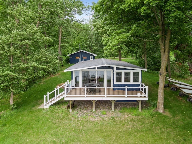 30558 376th Ave, Nordland Twp, MN 56431 - rear view of house featuring a deck and a yard