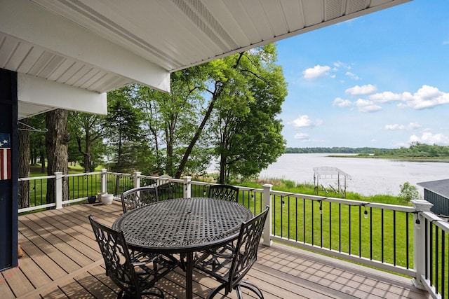 30558 376th Ave, Nordland Twp, MN 56431 - wooden deck featuring a water view, outdoor dining space, and a lawn