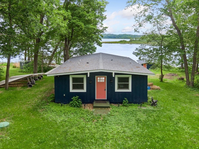 30558 376th Ave, Nordland Twp, MN 56431 - view of front of house featuring a water view, board and batten siding, a front lawn, and a metal roof