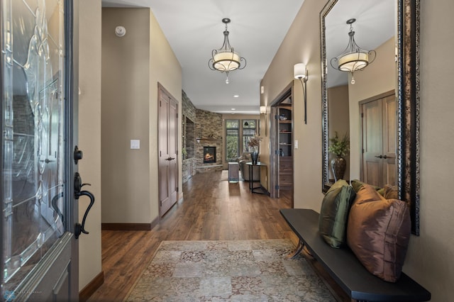 106 Beaton Dr, West Fargo, ND 58078 - foyer with dark wood finished floors and a fireplace