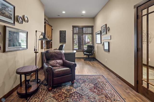 106 Beaton Dr, West Fargo, ND 58078 - sitting room with wood finished floors, baseboards, a desk, and recessed lighting