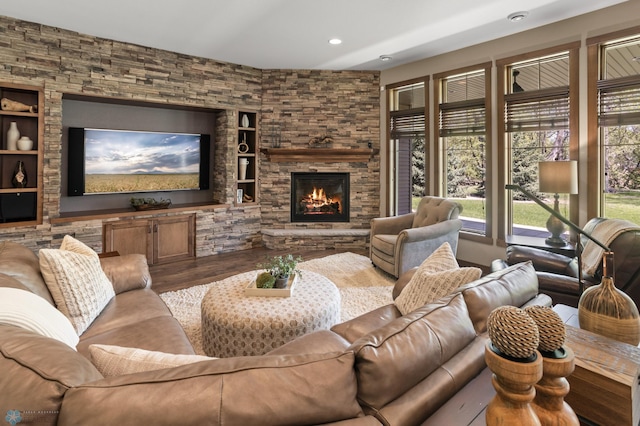 106 Beaton Dr, West Fargo, ND 58078 - living area with a fireplace, wood finished floors, recessed lighting, and built in shelves
