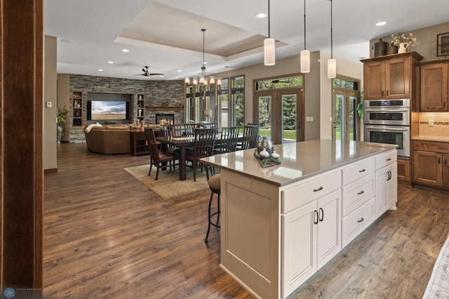 106 Beaton Dr, West Fargo, ND 58078 - kitchen featuring french doors, stainless steel double oven, dark wood-style floors, recessed lighting, and a chandelier