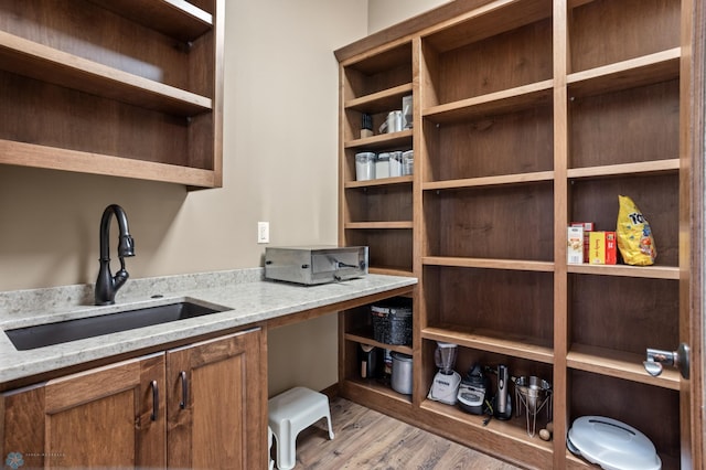 106 Beaton Dr, West Fargo, ND 58078 - home office with a sink and light wood finished floors