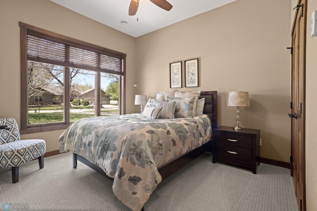 106 Beaton Dr, West Fargo, ND 58078 - bedroom with light colored carpet, baseboards, and a ceiling fan