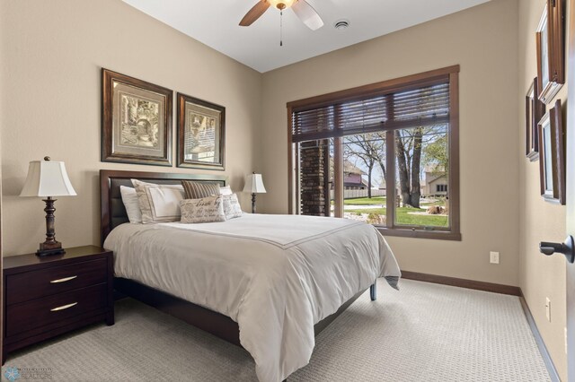 106 Beaton Dr, West Fargo, ND 58078 - bedroom featuring baseboards, light carpet, and ceiling fan