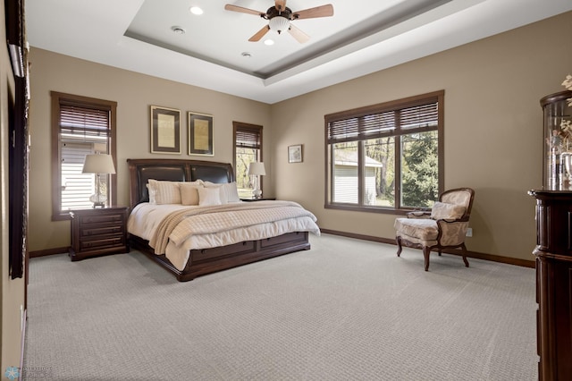 106 Beaton Dr, West Fargo, ND 58078 - bedroom featuring light carpet, baseboards, a raised ceiling, recessed lighting, and ceiling fan